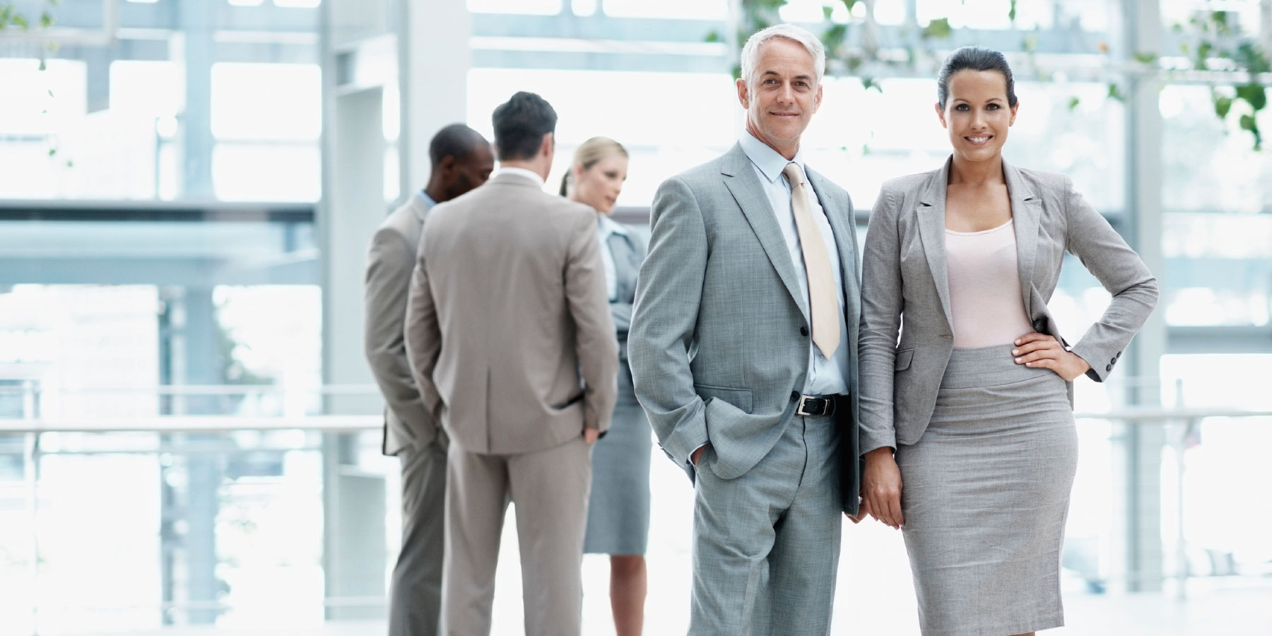 Group of Executives and Professionals Standing Together Group of Executives and Professionals Standing Together